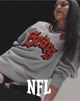 UnitedMasters + NFL - A woman with long hair in a Chicago Bears sweatshirt with a white NFL logo